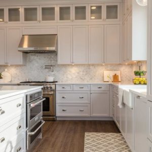 Stainless Steel Stove Hood with White Cabinets